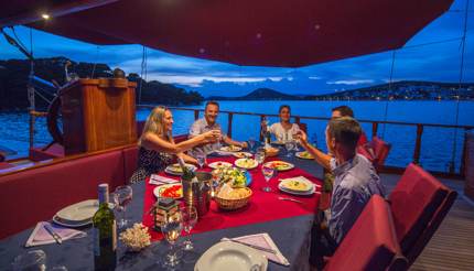 Enjoying a sumptuous dinner on board