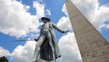 Bunker Hill Monument in Boston, Massachusetts. Granite obelisk and bronze statue of Colonel William Prescott