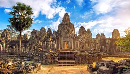 Ancient stone faces at sunset of Bayon temple, Angkor Wat, Siam Reap, Cambodia