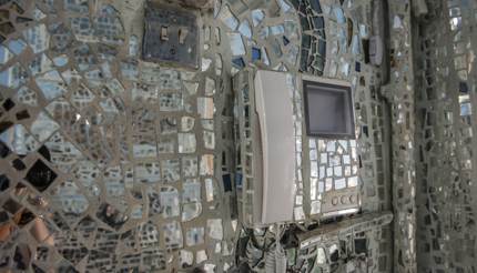 Interior of house covered in a mosaic of mirrors