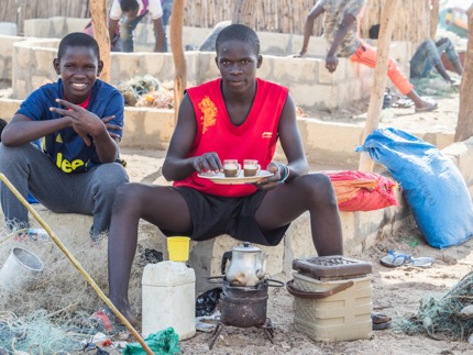 Men making tea on the beach